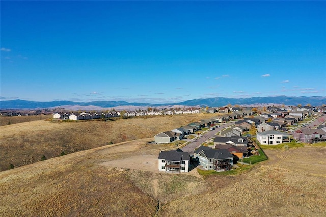 birds eye view of property featuring a mountain view