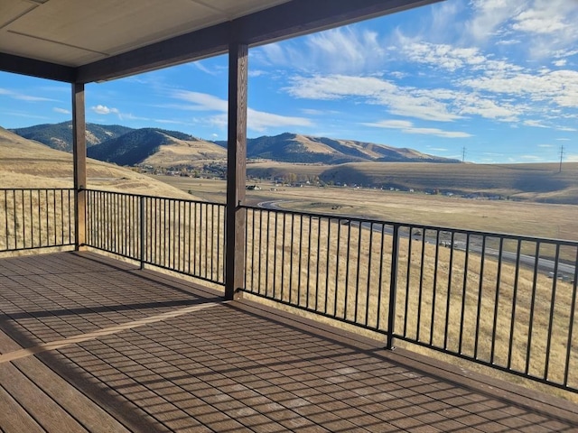 deck with a mountain view and a rural view