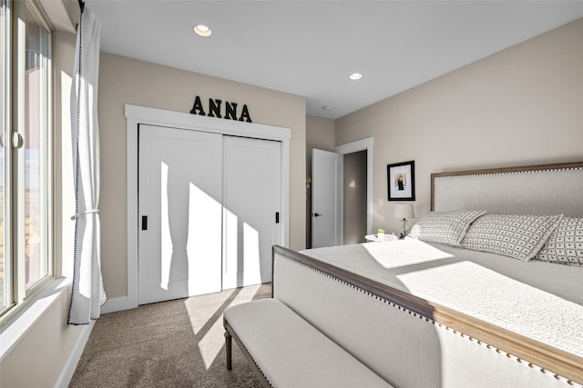 bedroom with carpet flooring and a closet