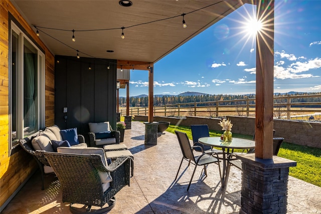 view of patio / terrace featuring a mountain view and an outdoor hangout area