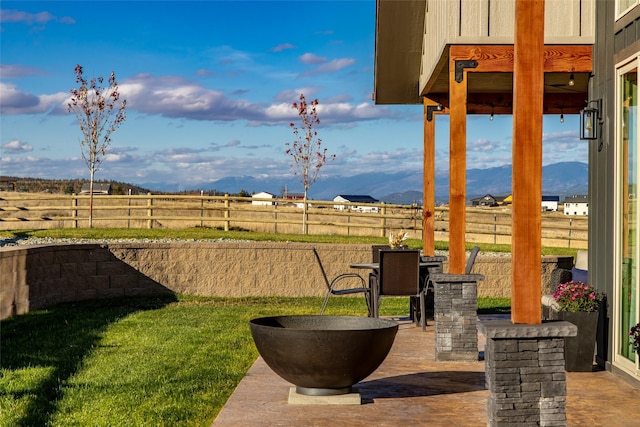 view of yard with a patio area, a mountain view, and an outdoor bar