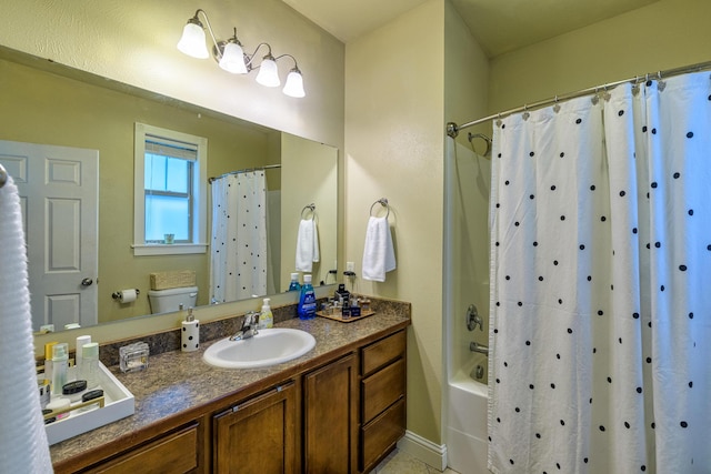 bathroom featuring tile patterned flooring, shower / bath combo, and vanity