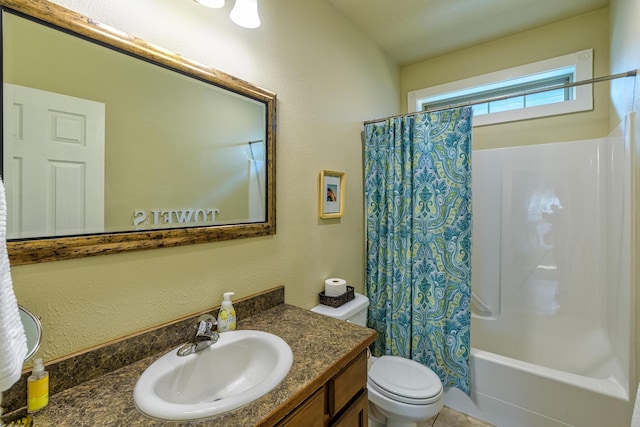 full bathroom featuring vanity, toilet, and shower / tub combo