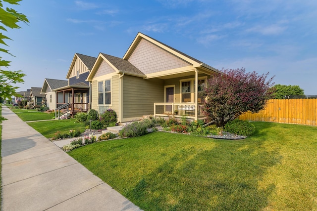 view of front of home featuring a porch and a front yard