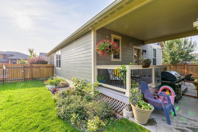 doorway to property featuring a yard