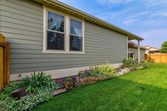 view of property exterior featuring a yard