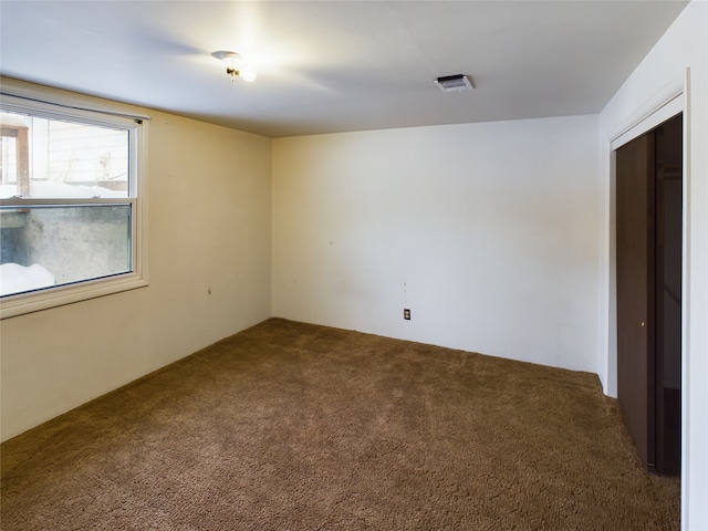 unfurnished room featuring carpet floors