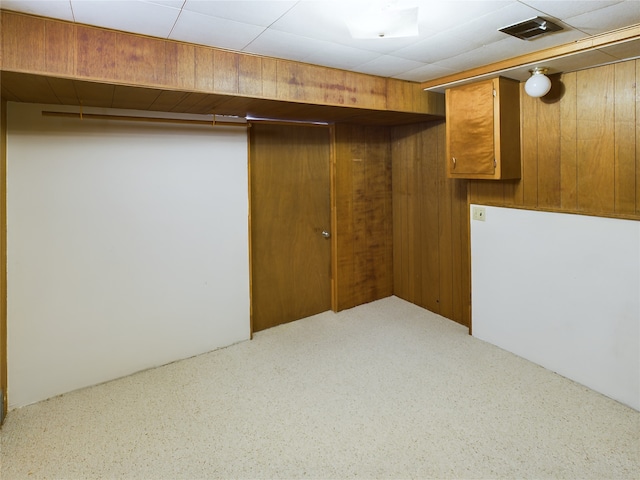 basement with wood walls