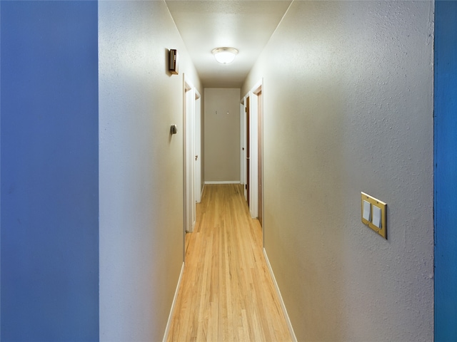 hallway featuring light wood-type flooring