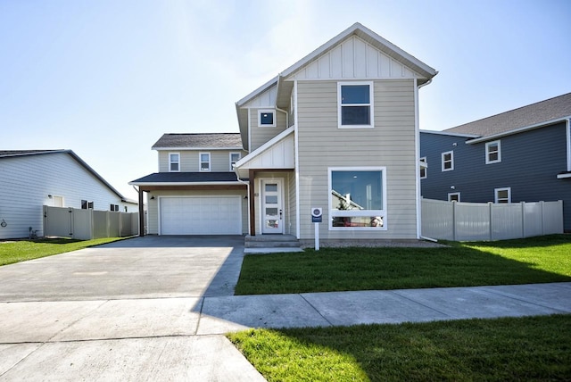 view of front of home with a front yard and a garage