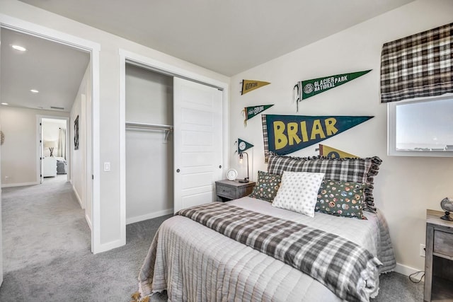 carpeted bedroom featuring a closet