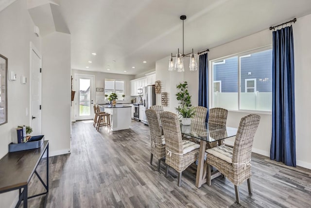 dining area featuring a healthy amount of sunlight and light wood-type flooring