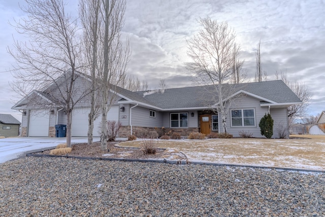 ranch-style home featuring a garage