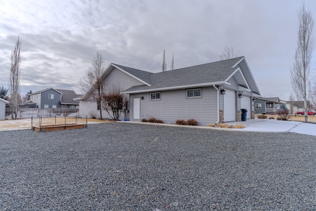 view of side of home with a garage