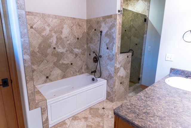 bathroom with vanity and independent shower and bath