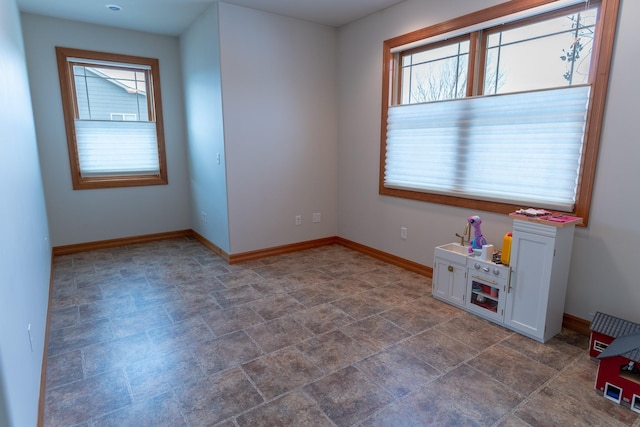 unfurnished room featuring a wealth of natural light