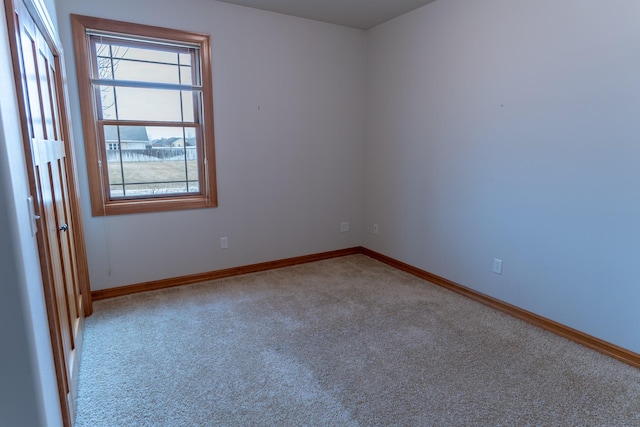 carpeted empty room with plenty of natural light