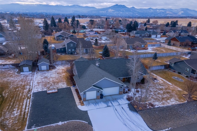 birds eye view of property with a mountain view