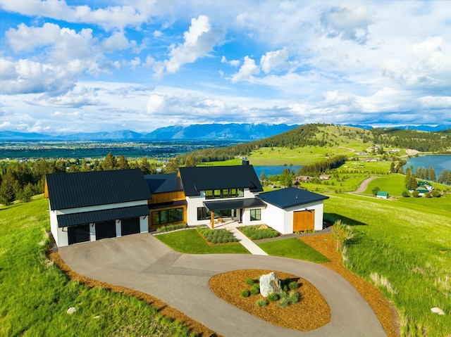 view of front of house featuring a water and mountain view