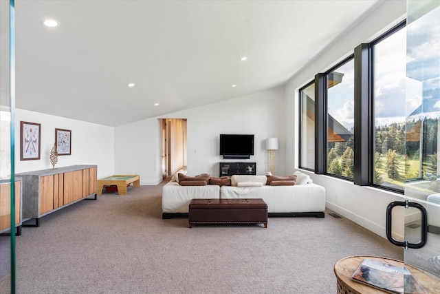 carpeted living room featuring lofted ceiling