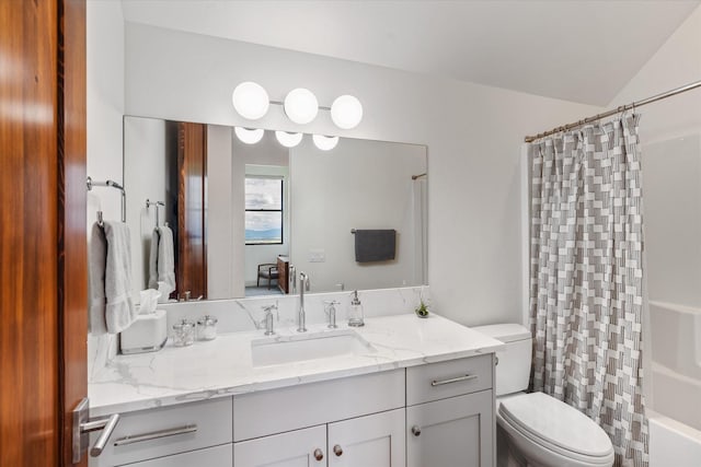 full bathroom featuring vanity, shower / bath combination with curtain, lofted ceiling, and toilet