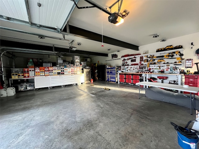 garage featuring a workshop area and a garage door opener