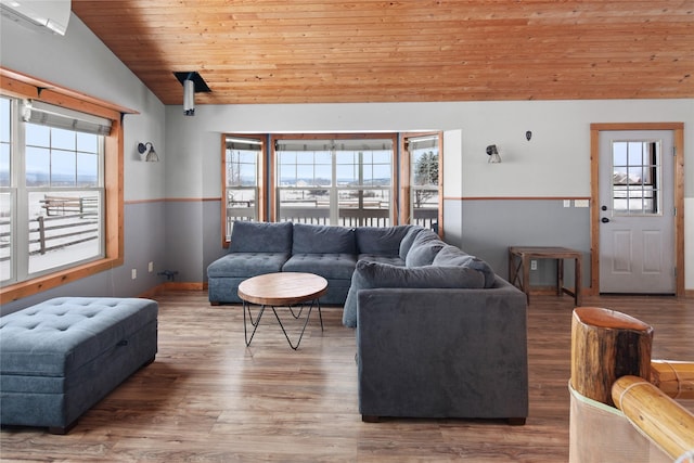 living room with hardwood / wood-style floors, a healthy amount of sunlight, lofted ceiling, and wood ceiling