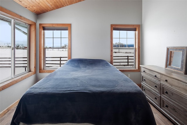 bedroom with wood ceiling, lofted ceiling, and wood-type flooring