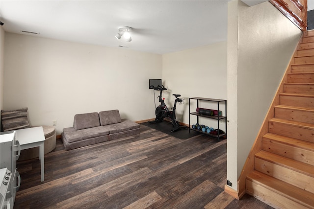 workout area featuring dark hardwood / wood-style floors