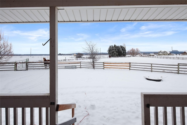 view of yard layered in snow