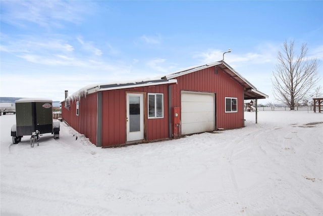 view of snow covered garage