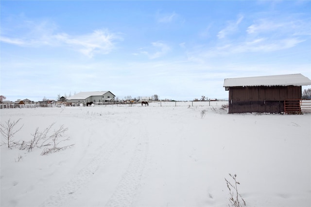 view of yard layered in snow