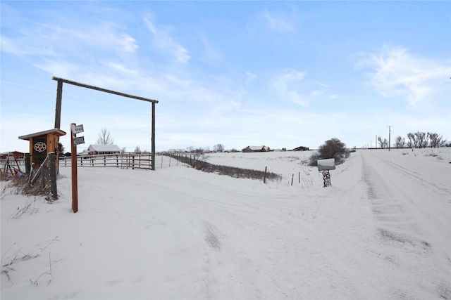 view of yard layered in snow