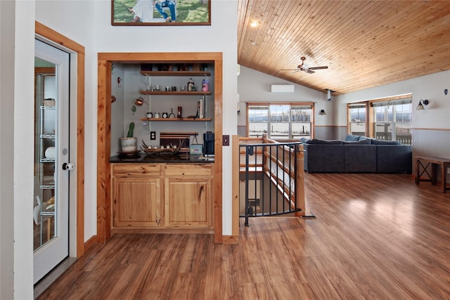 bar featuring ceiling fan, vaulted ceiling, light brown cabinetry, wood ceiling, and hardwood / wood-style flooring