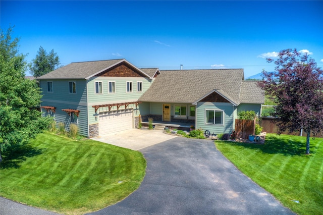 view of front of home featuring a garage and a front yard