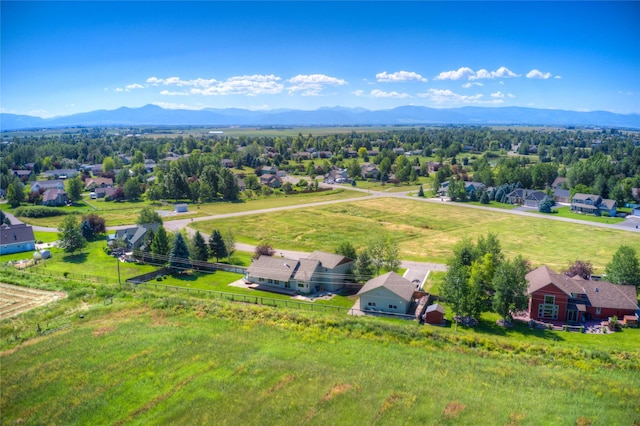 birds eye view of property featuring a mountain view