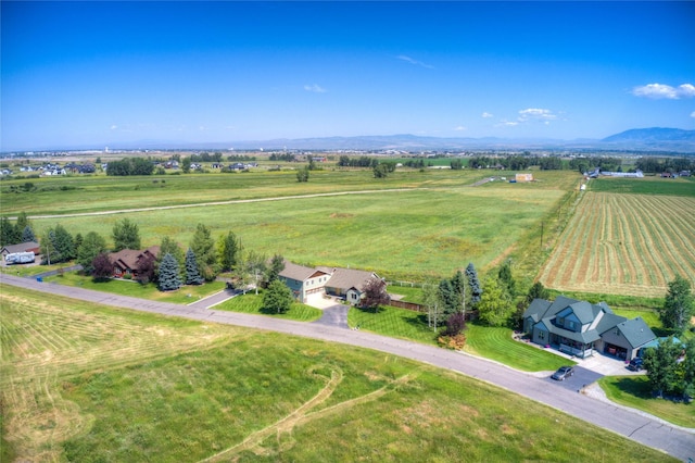 drone / aerial view with a mountain view and a rural view