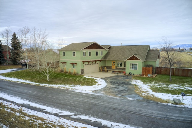 view of front of property with a lawn and a garage