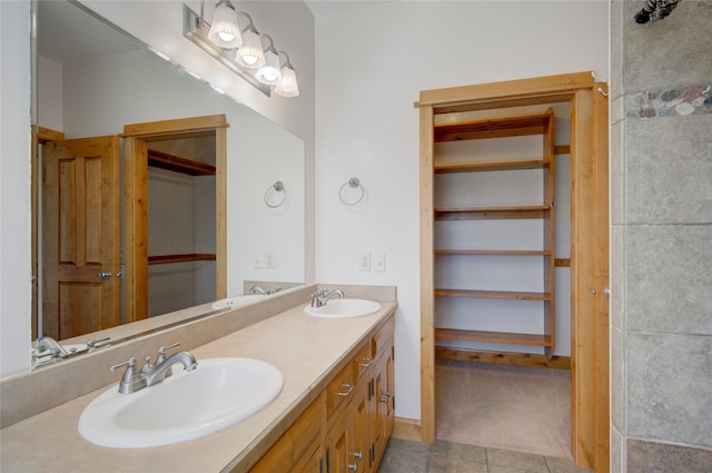 bathroom with tile patterned floors and vanity