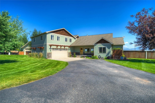 view of front facade featuring a front lawn and a garage