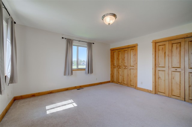 unfurnished bedroom with light carpet