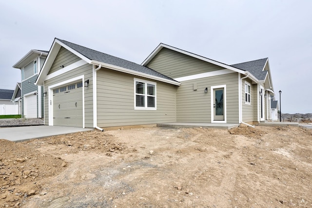 view of front of home with a garage