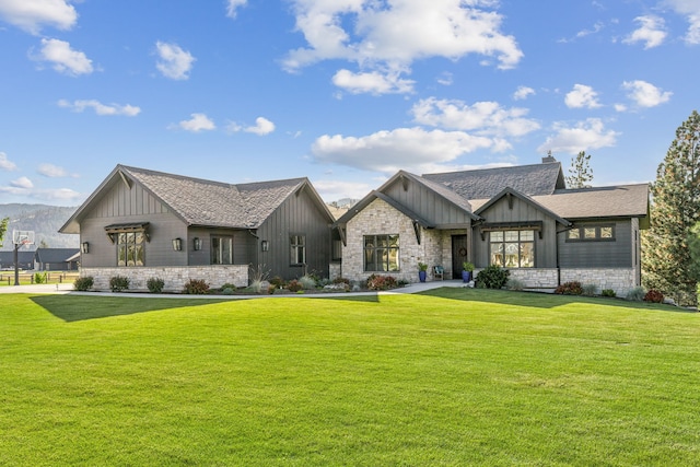 modern inspired farmhouse with a front lawn