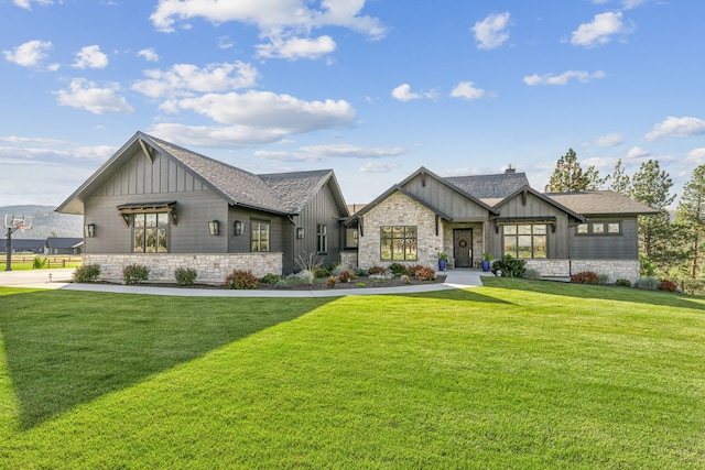 modern farmhouse style home featuring a front yard