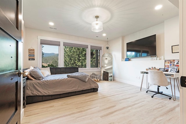 bedroom with light wood-type flooring