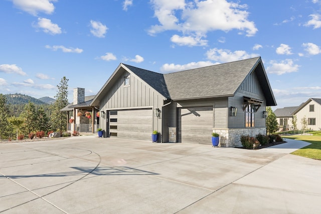 view of front of property featuring a mountain view and a garage