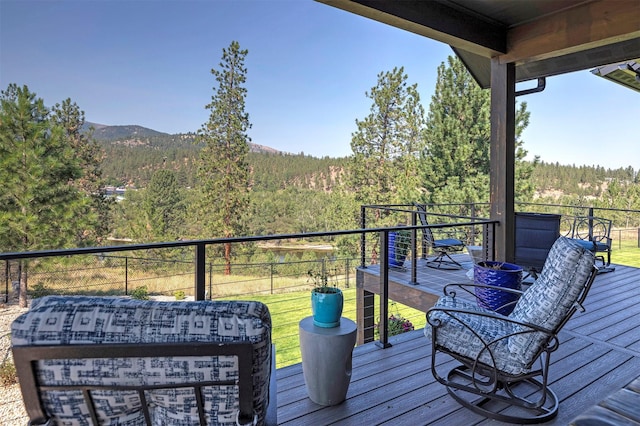 wooden terrace with a mountain view