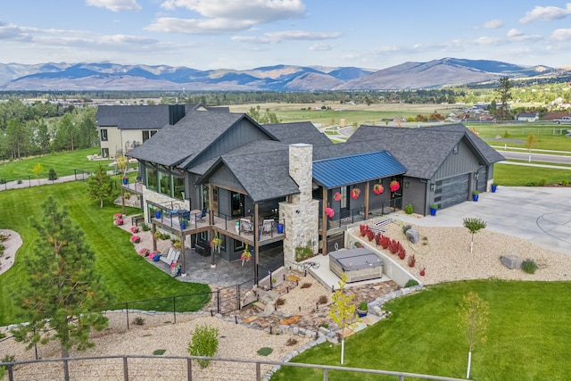 drone / aerial view featuring a mountain view