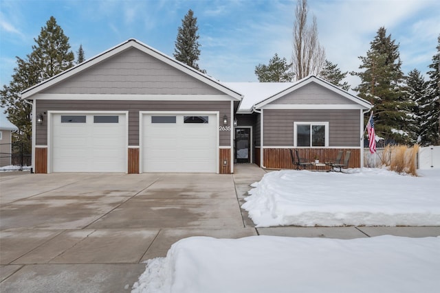 single story home featuring a garage