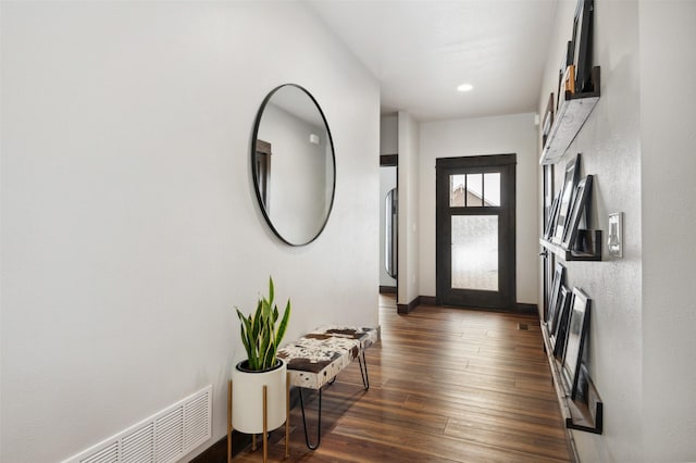 entryway with dark wood-type flooring